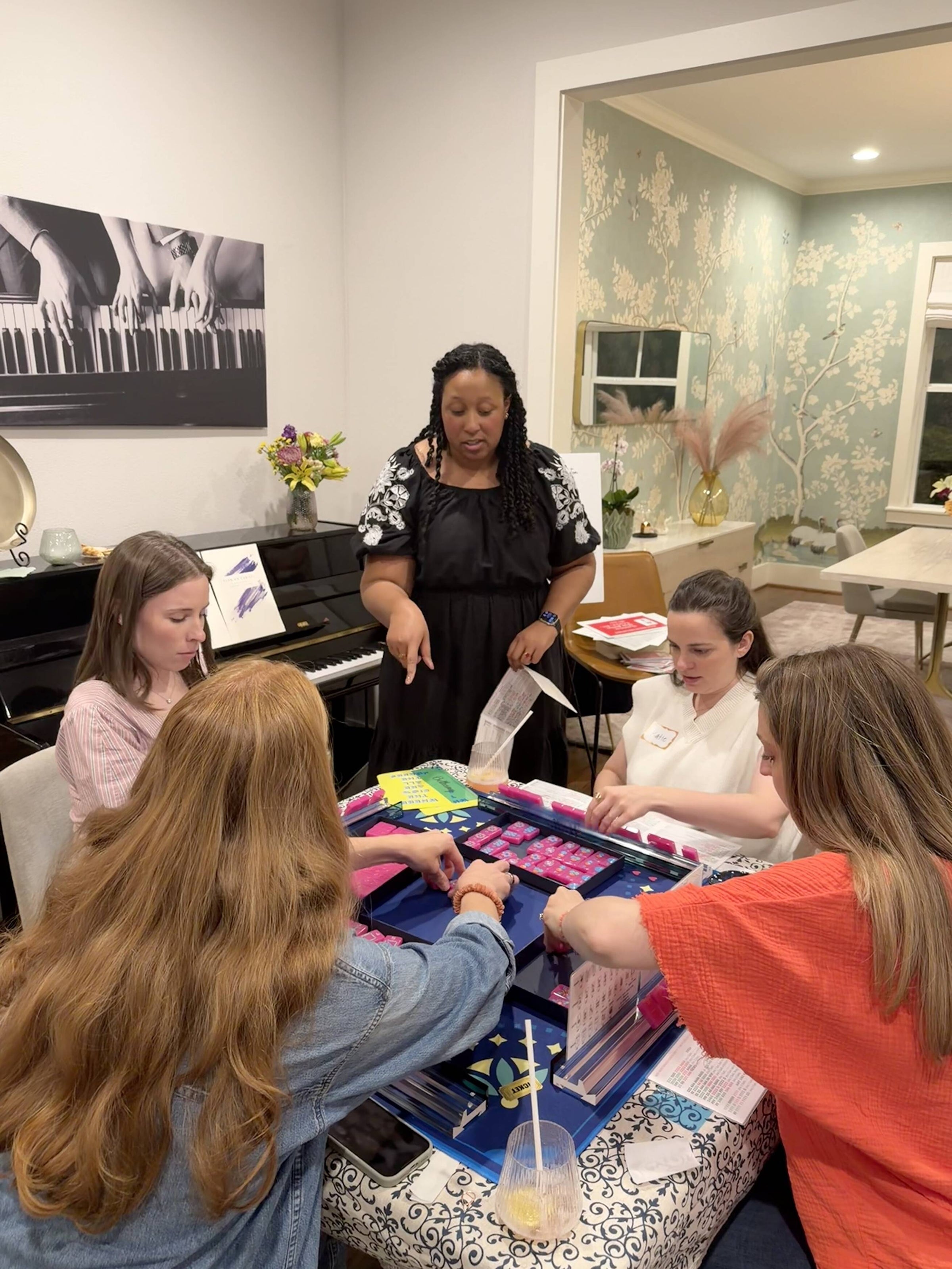 Adrianne teaching mahjong